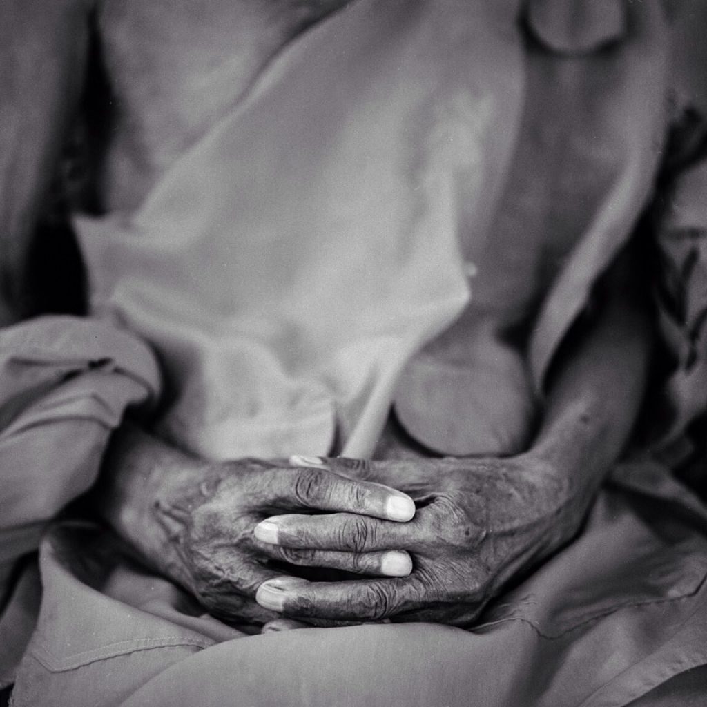 Black and white abstract photograph of hands shot on ILFORD Delta 100 by Giancomo Frullani