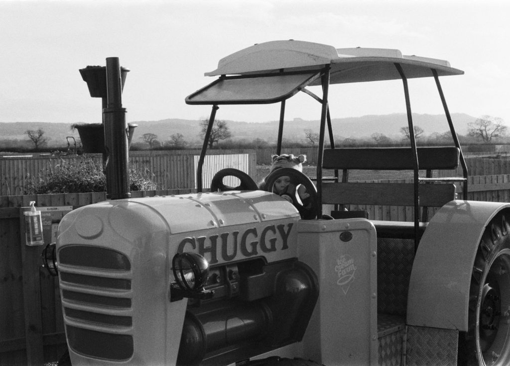 Black and white film photograph of tractor shot at Wheelock on ILFORD Dleta 400 film