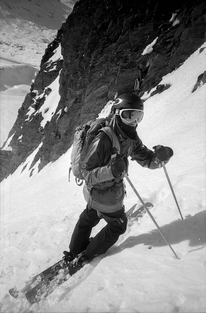 lack and white film shot of skiier in Alasska by Hunter Bailey