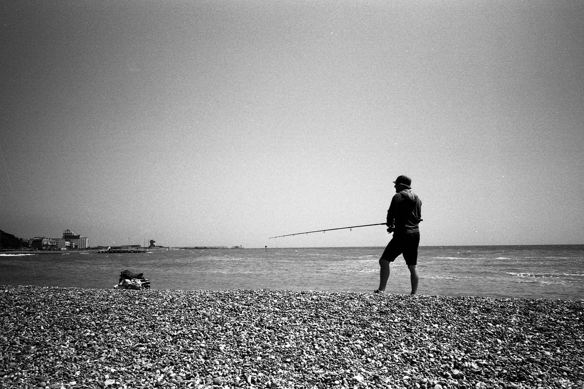 Black and white film p phopto of man fishing #bythesea for #fridayfavourites Shot on ILFORD fp4 film by @calor_gas_terry