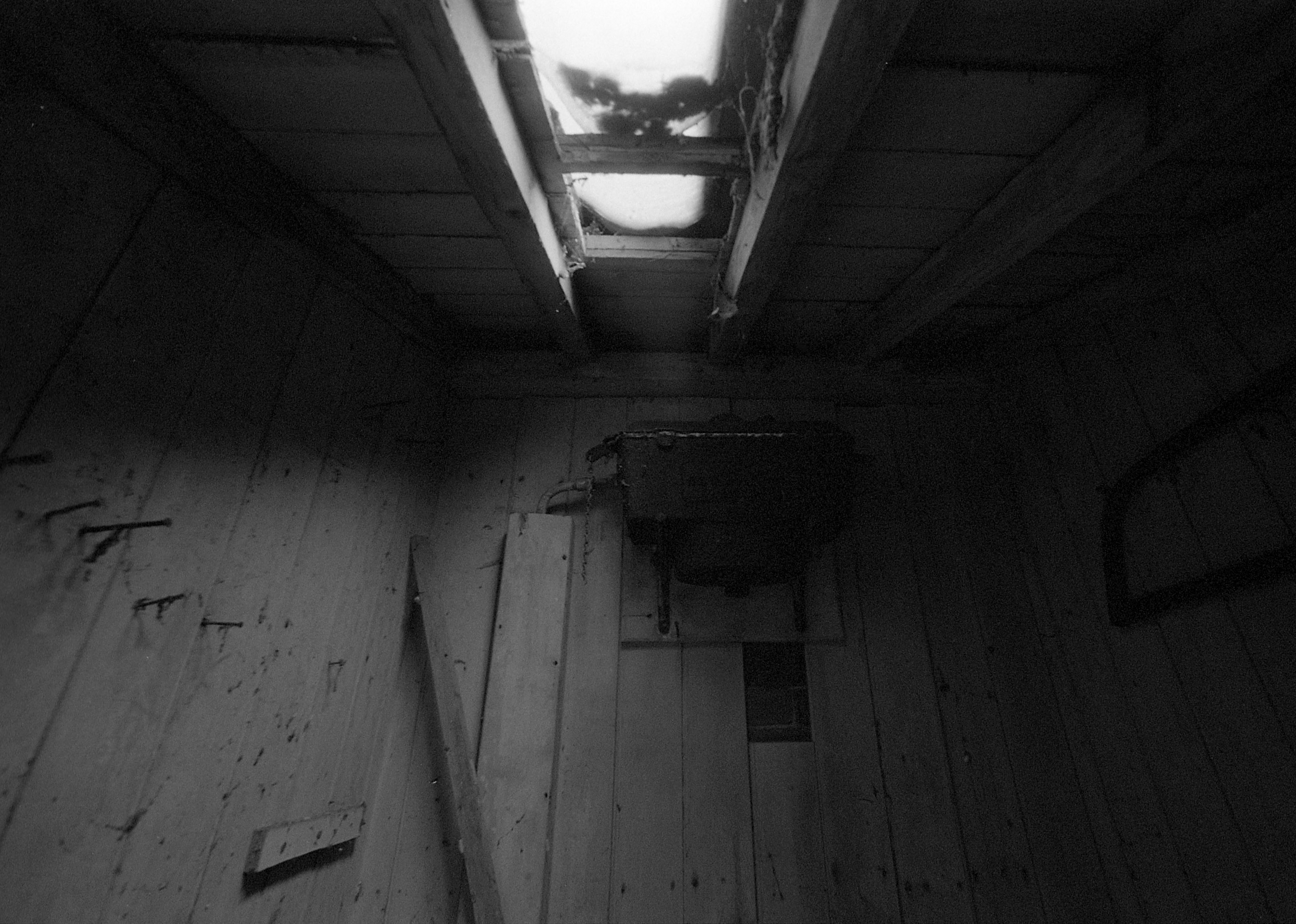 Black and white photo pof interior of old building shot on expired HP5 black and white film by Jason Avery