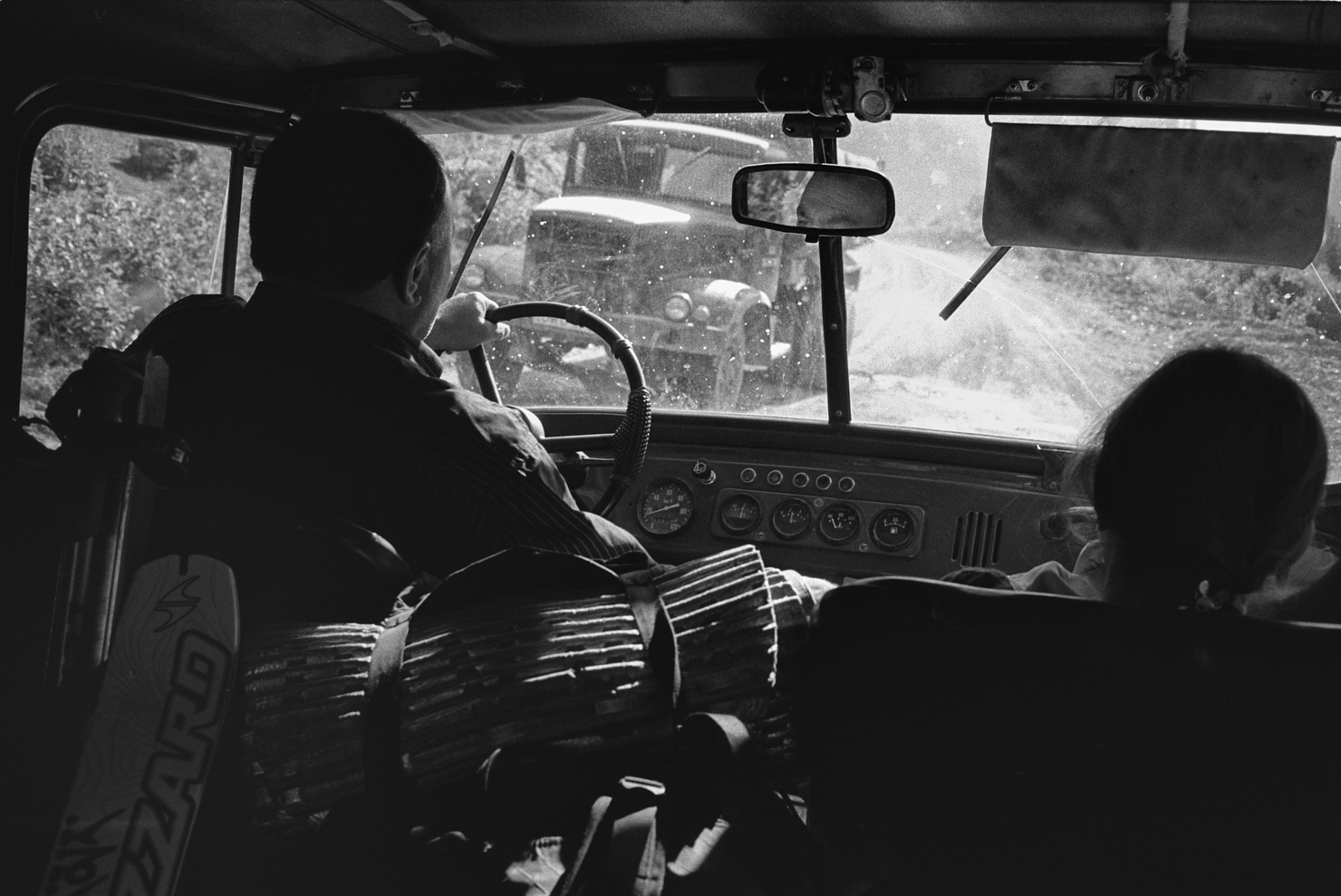 Hitching a ride back from the mountains with locals. Svaneti, Georgia (Caucasus), June 2012. Contax T3, B+W yellow filter and Ilford HP5+ (in HC-110). Nikon Coolscan 8000ED scan.