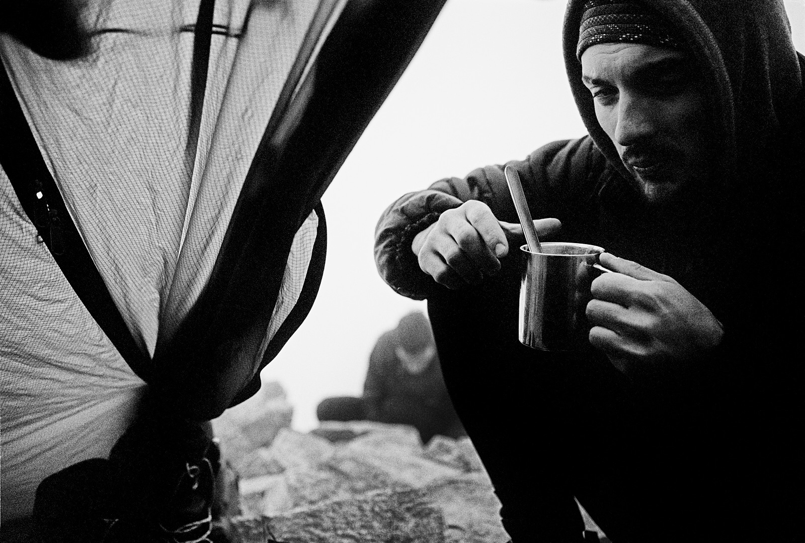 A minute of calm and warmth. Ushba (4710m) High Camp. Georgia, Caucasus, 2012. Leica M7, Zeiss ZM C-Biogon 2.8/35mm, Heliopan yellow filter and Ilford FP4+ (in FX-39). Flextight X1 Scan. Climber: Tato Nadiradze