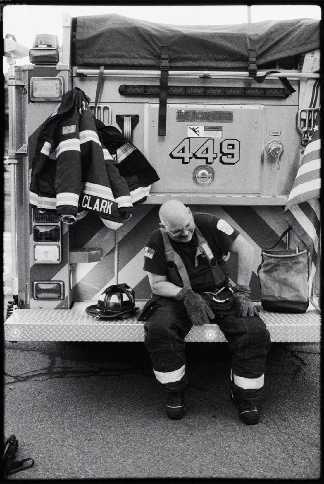 @MattAngleyPhoto “Smoked” Fireman Scott Clark takes a break on the back bumper of a fire engine at a fire scene Camera Canon AE-1 + Canon FD 50mm f/1.4 🎞 Ilford Delta 3200 #ilfordphoto #fridayfavourites #specialistfilm #filmphotography #believeinfilm #delta3200 #ilfordfilm #blackandwhitephotography