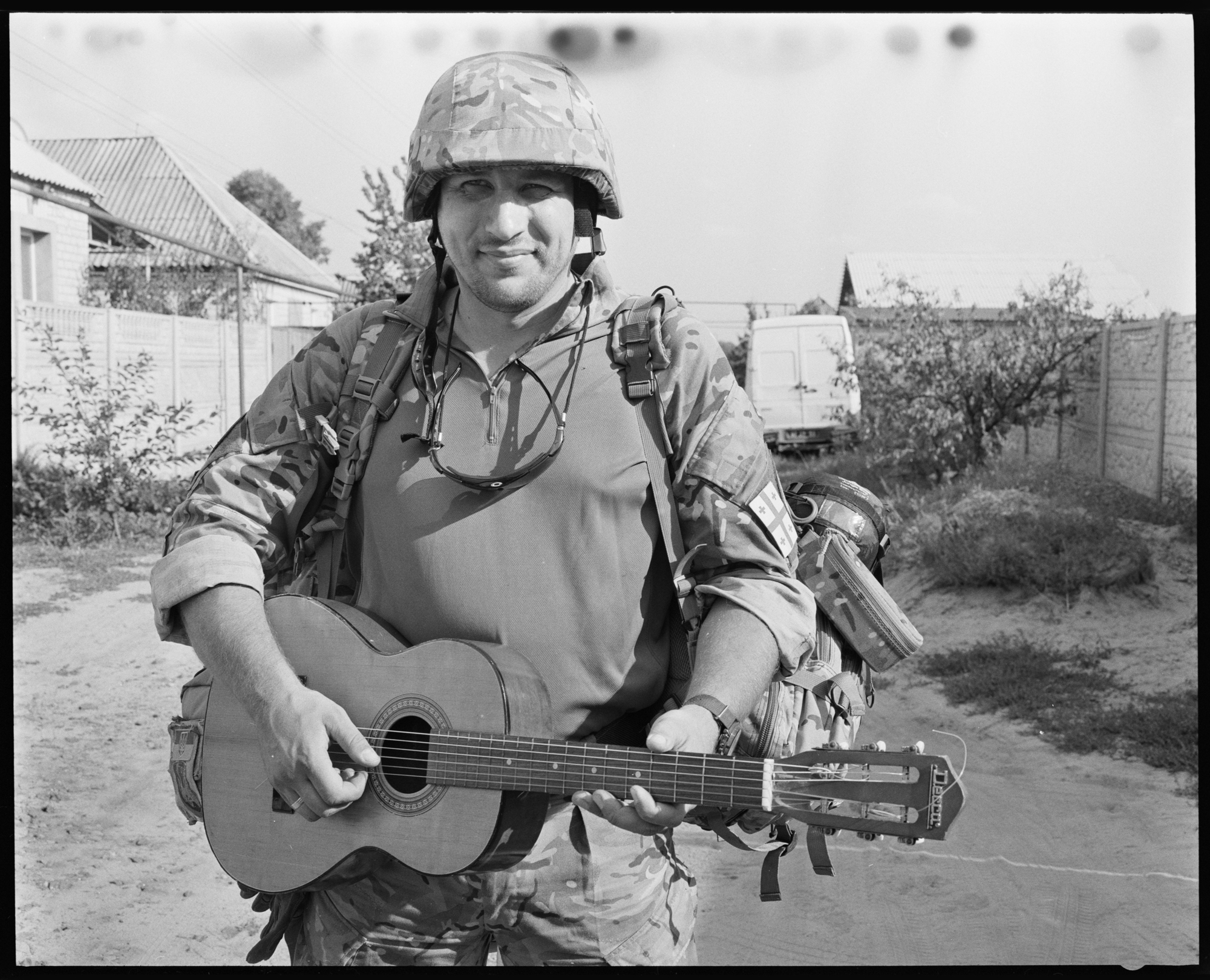 Soldier with guitar by Brett Hillyard on ILFORD black and white HP5+ Film