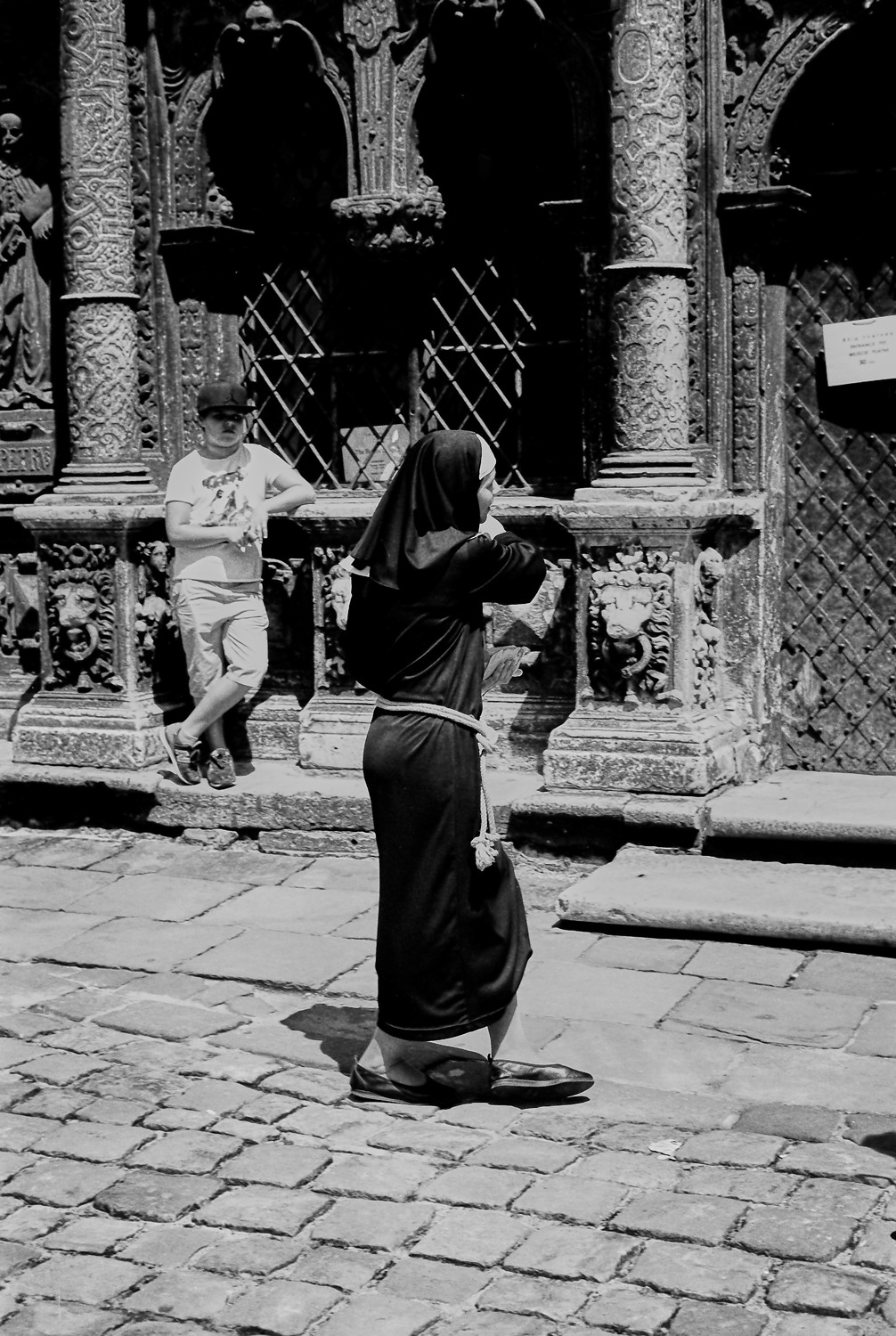 @hejrevell Young Nun entering 17th Century Boom Chapel in Lviv Ukraine. ILFORD PanF Plus, Leica M7 | 50mm Summicron Lens. #ilfordphoto @ILFORDPhoto #fridayfavourites #Leica #LeicaCameraUSA