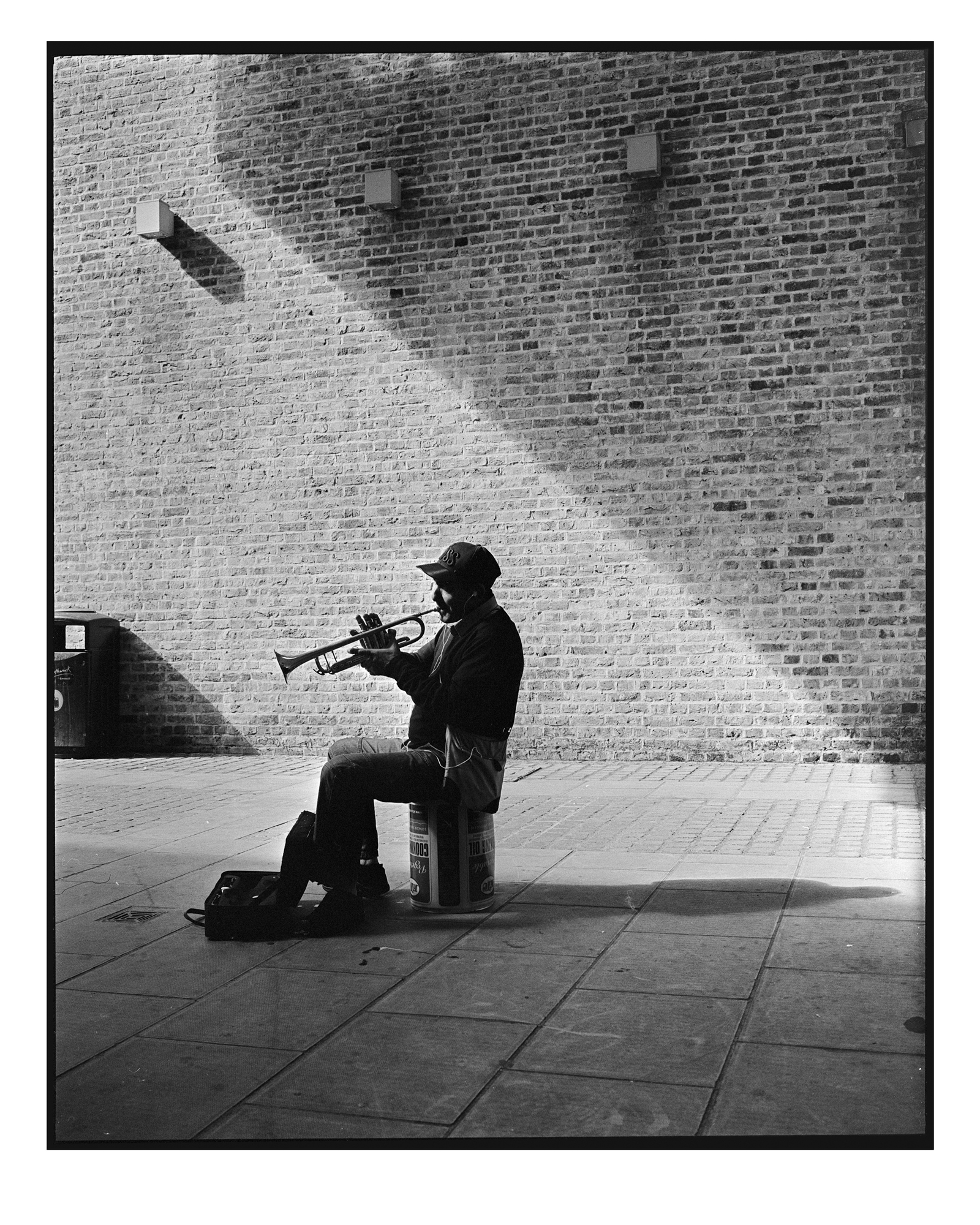 Street performer by Brett Hillyard on ILFORD black and white HP5+ Film