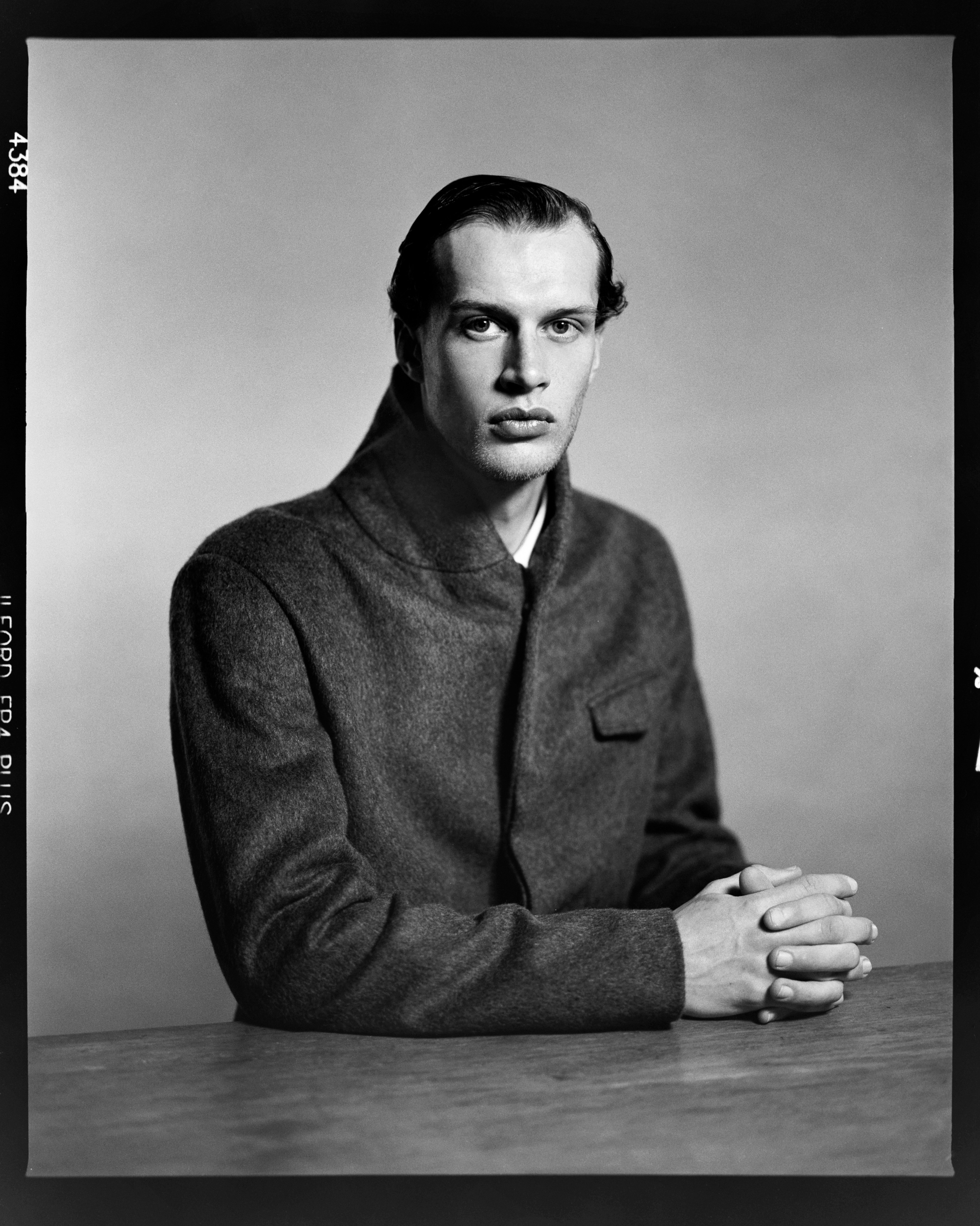 Black and white portrait of a man shot on ILFORD FP4 4x5 black and shite film by Craig Fleming