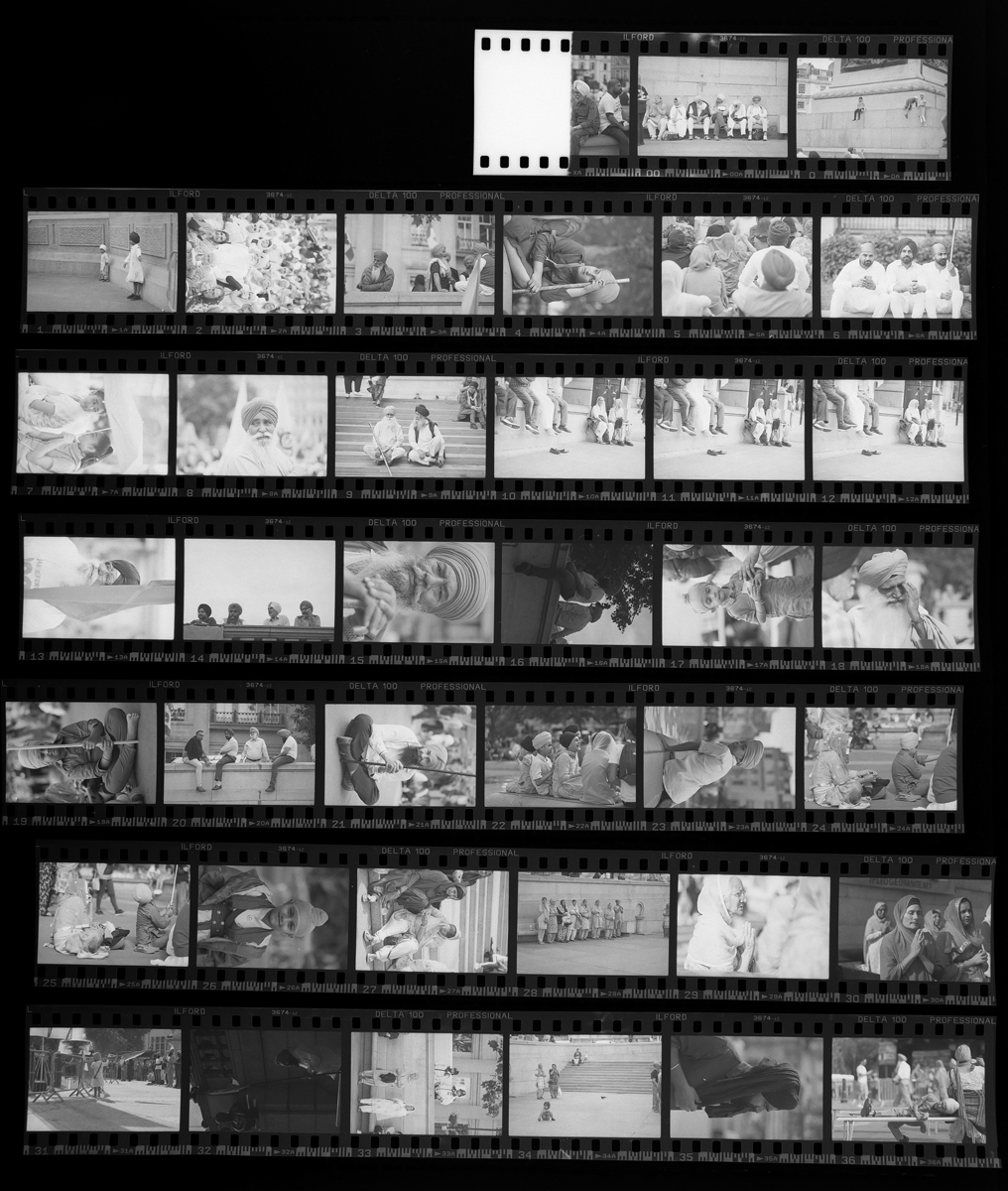 Contact sheet of black and white film image of Sikh remembrance day shot on ILFORD Delta 100 film by Simon King