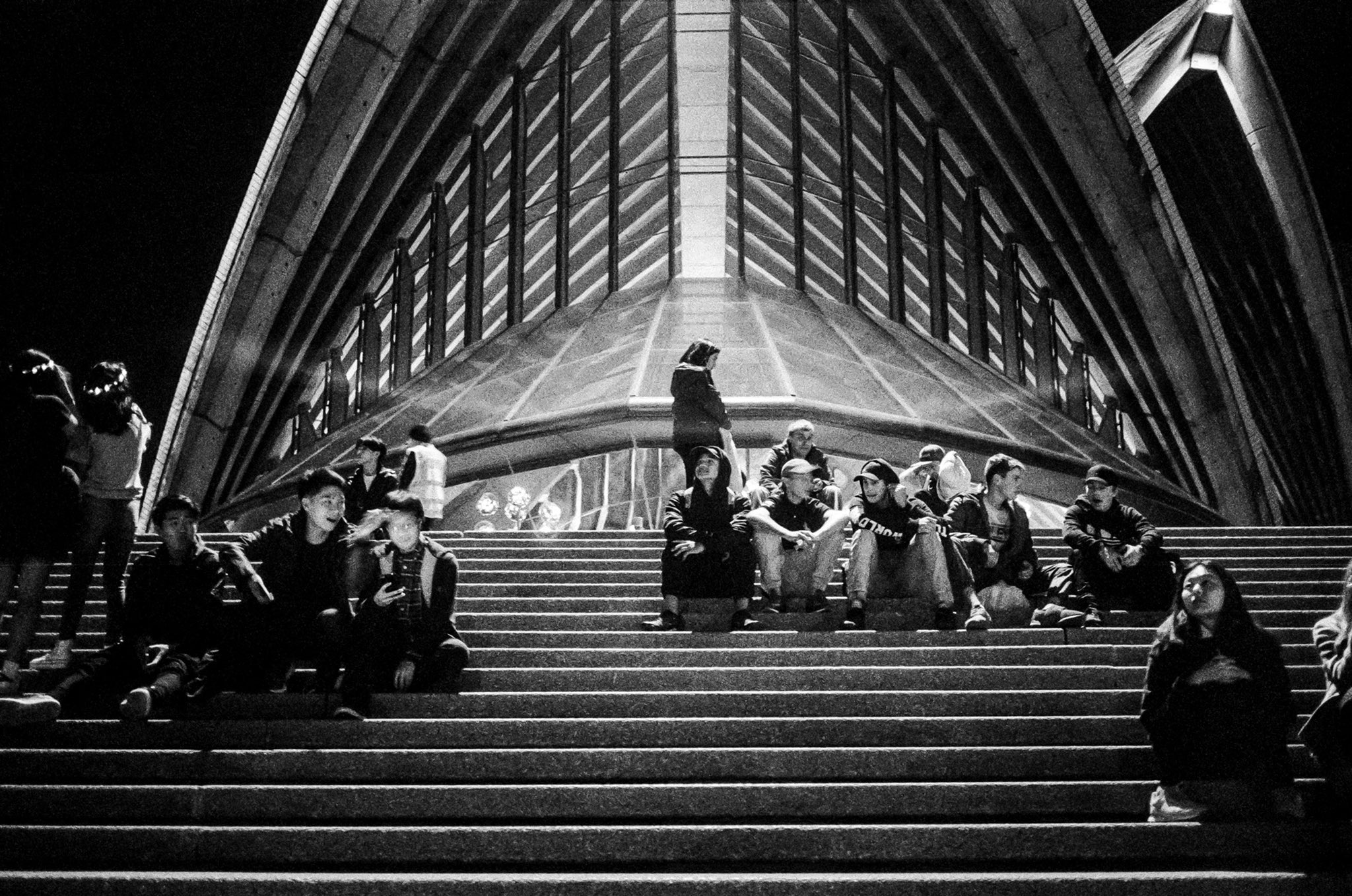 @billthoo Replying to @ILFORDPhoto Steps to humans are like reefs to fish. We are drawn to gather there. Sydney. May 2018. @ILFORDPhoto #delta3200. #M4 + #Voigtlander 35/2.5. #filmpeople #fridayfavourites #ilfordphoto #shootfilmbenice #believeinfilm #filmphotography #leica #ilovesydney #newsouthwales