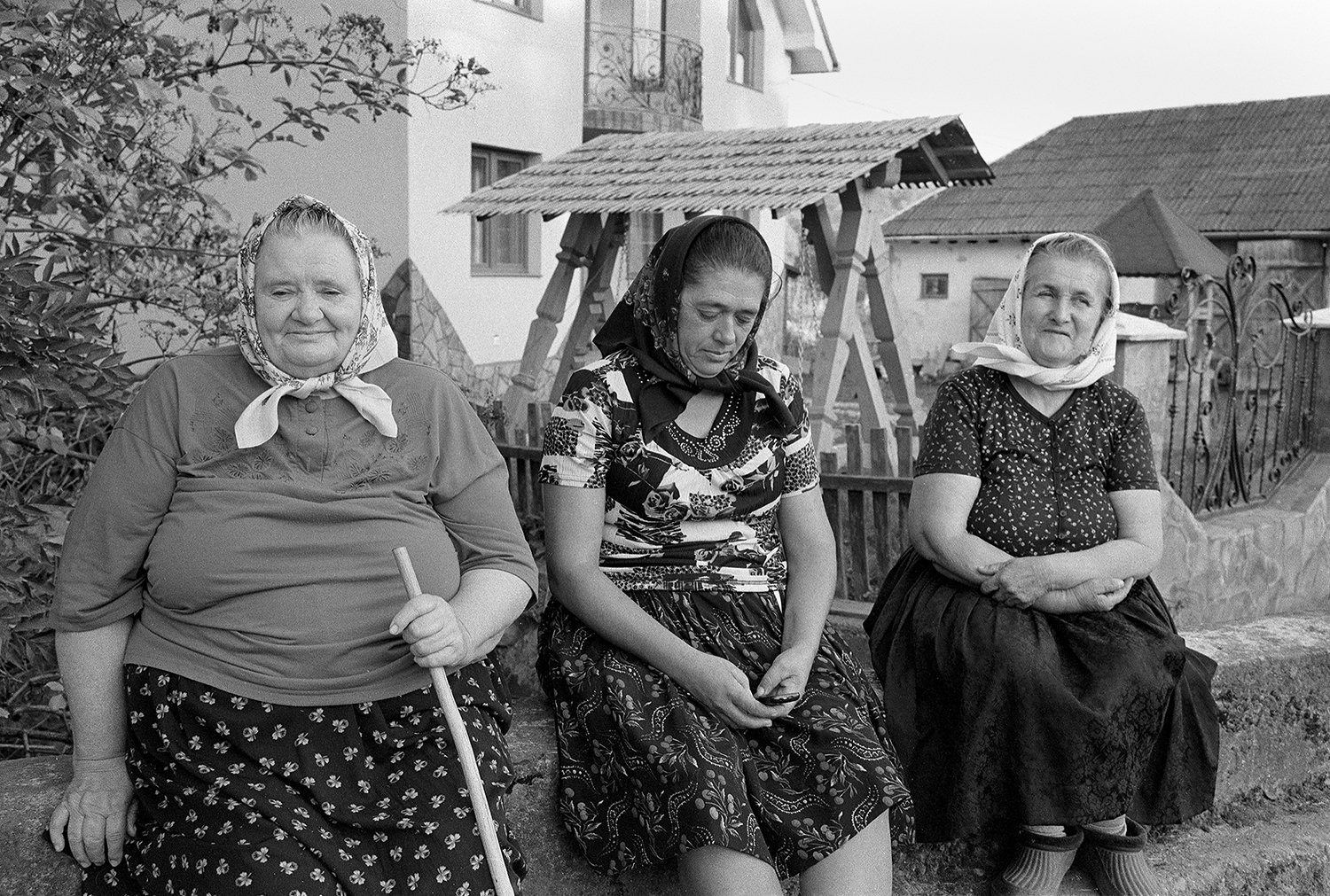 Street photo of three ladys in breb maremures Romania shot on ILFORD black and white film by Keith Moss