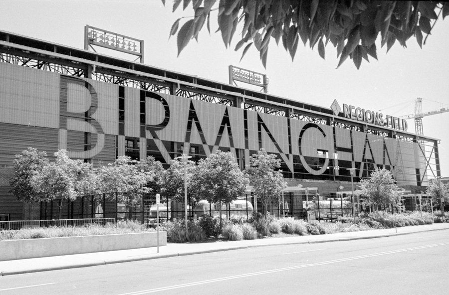 @bsanfordjr Replying to @ILFORDPhoto Regions Field in Birmingham, AL opened in 2013 as part of ongoing downtown redevelopment efforts. The facade is visible to motorists traveling through the city on I-65. Seen here on HP5+ and is lit by colorful lights at night. #ilfordphoto #fridayfavourites #sightseeing