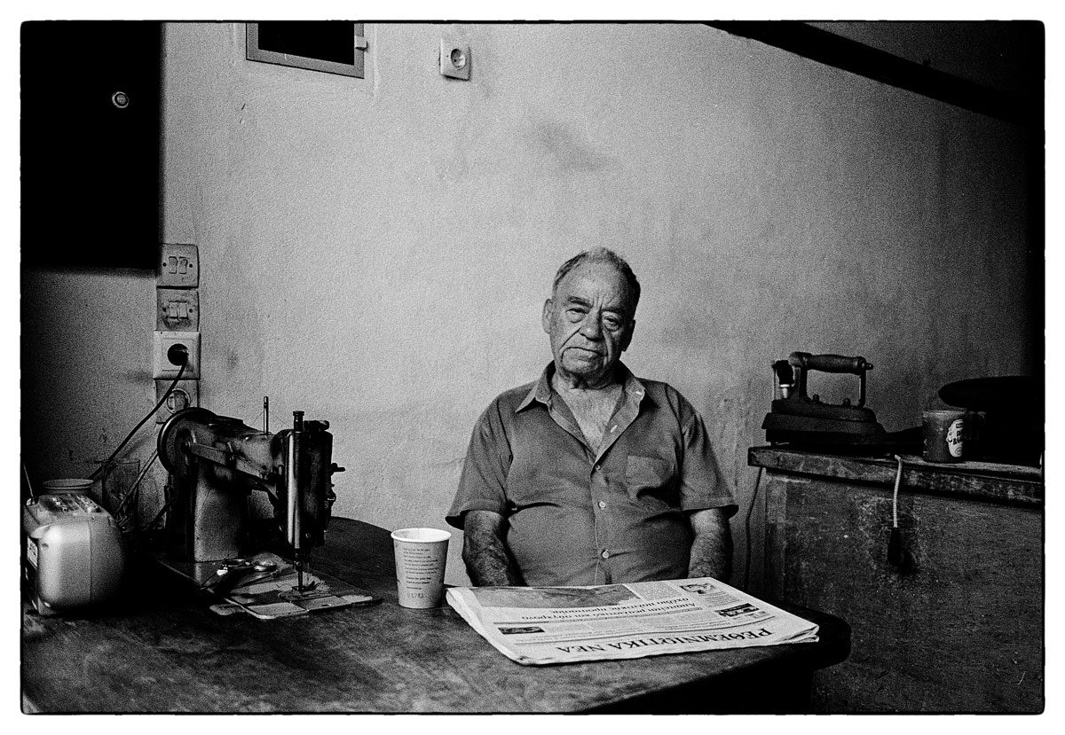 Tailor - A backstreet tailor in Crete, Canon F1, HP5+ at iso 800 ©David Collyer