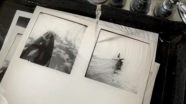 Mike Caputo making a photobook with darkroom prints
