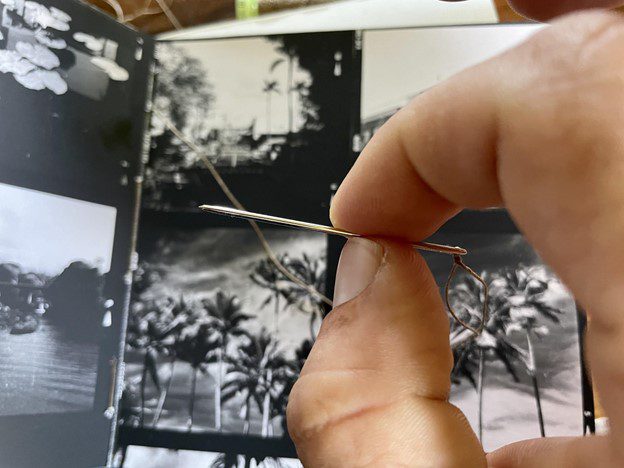 Mike Caputo making a photobook with darkroom prints