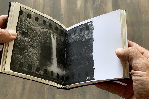 Mike Caputo making a photobook with darkroom prints