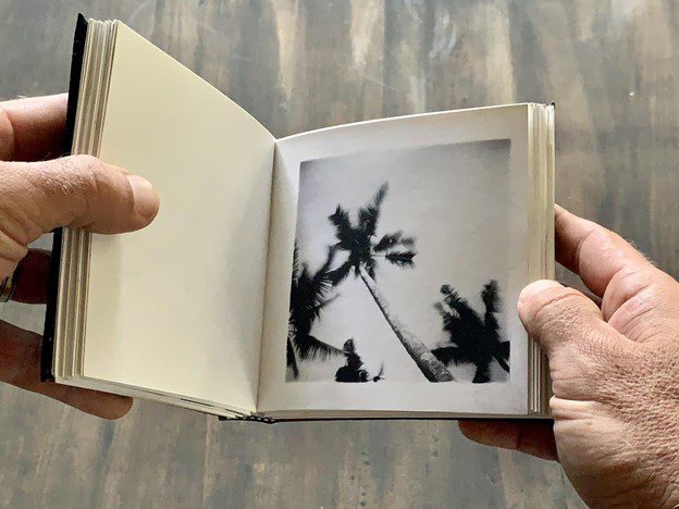 Mike Caputo making a photobook with darkroom prints