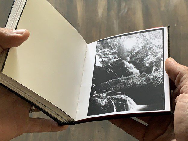 Mike Caputo making a photobook with darkroom prints