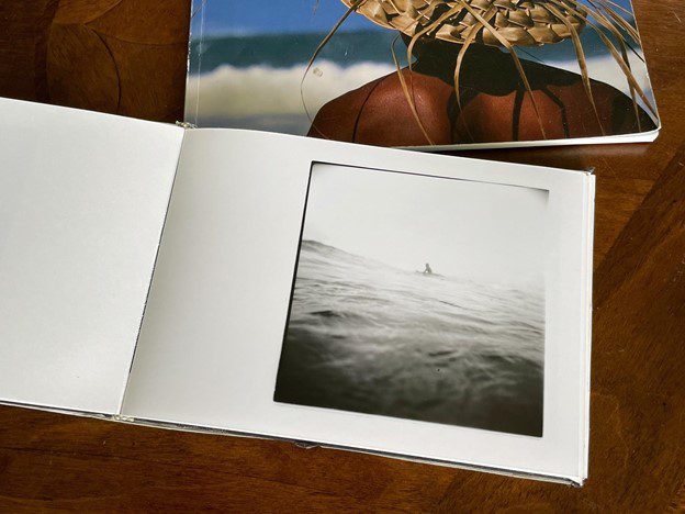 Mike Caputo making a photobook with darkroom prints