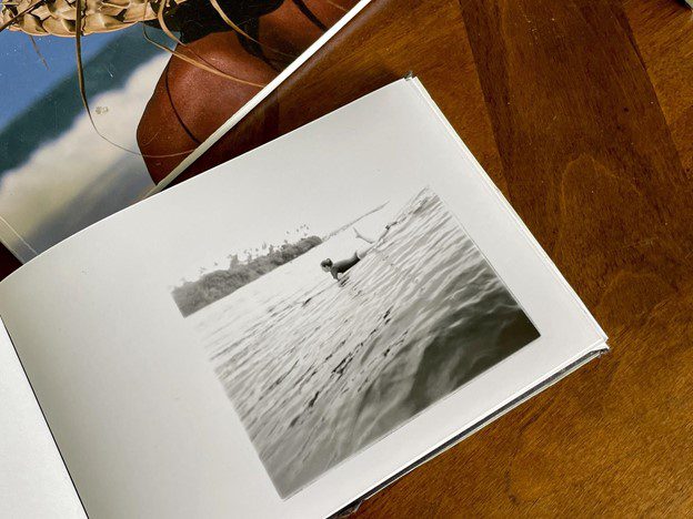 Mike Caputo making a photobook with darkroom prints