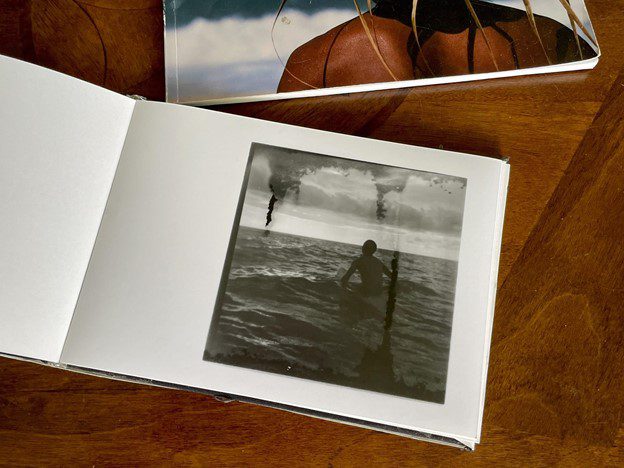 Mike Caputo making a photobook with darkroom prints