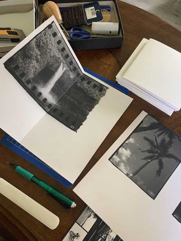 Mike Caputo making a photobook with darkroom prints