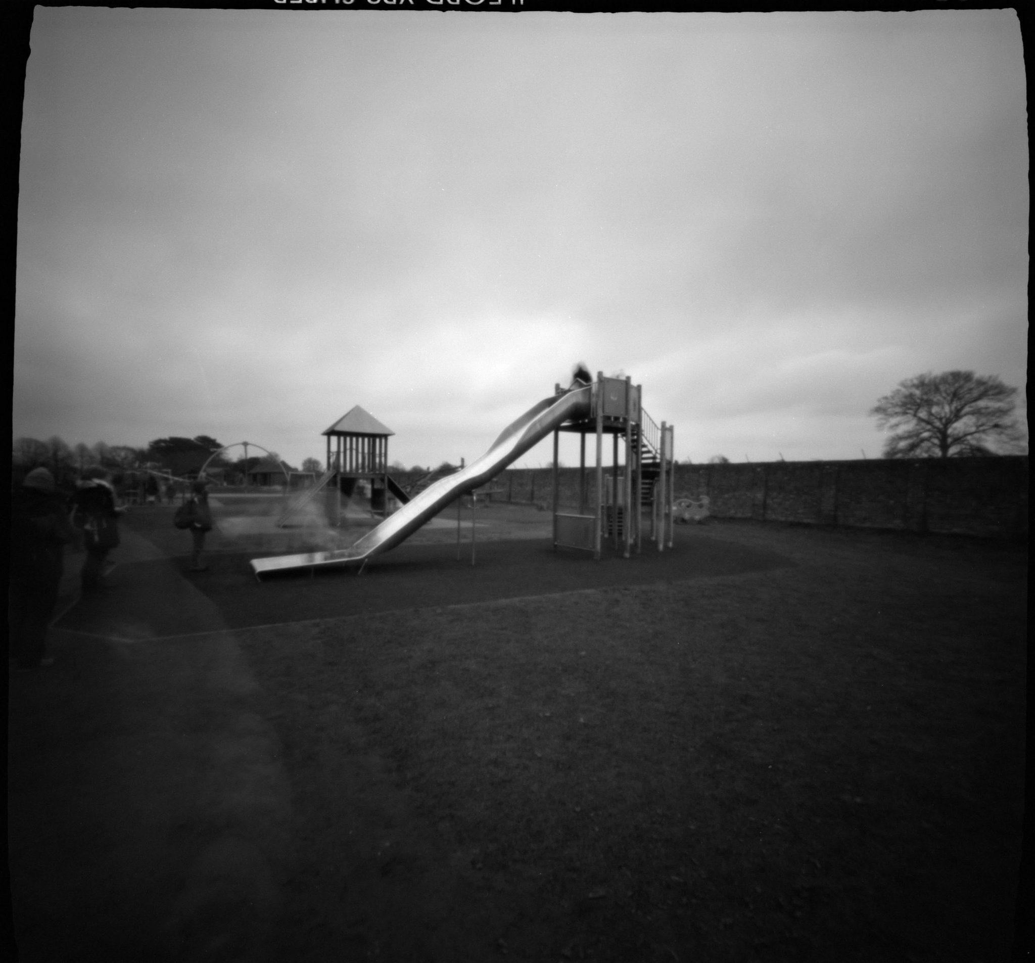 Pinhole image of a slide in a park
