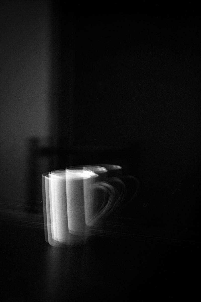 Long exposure black and white photo of a mug