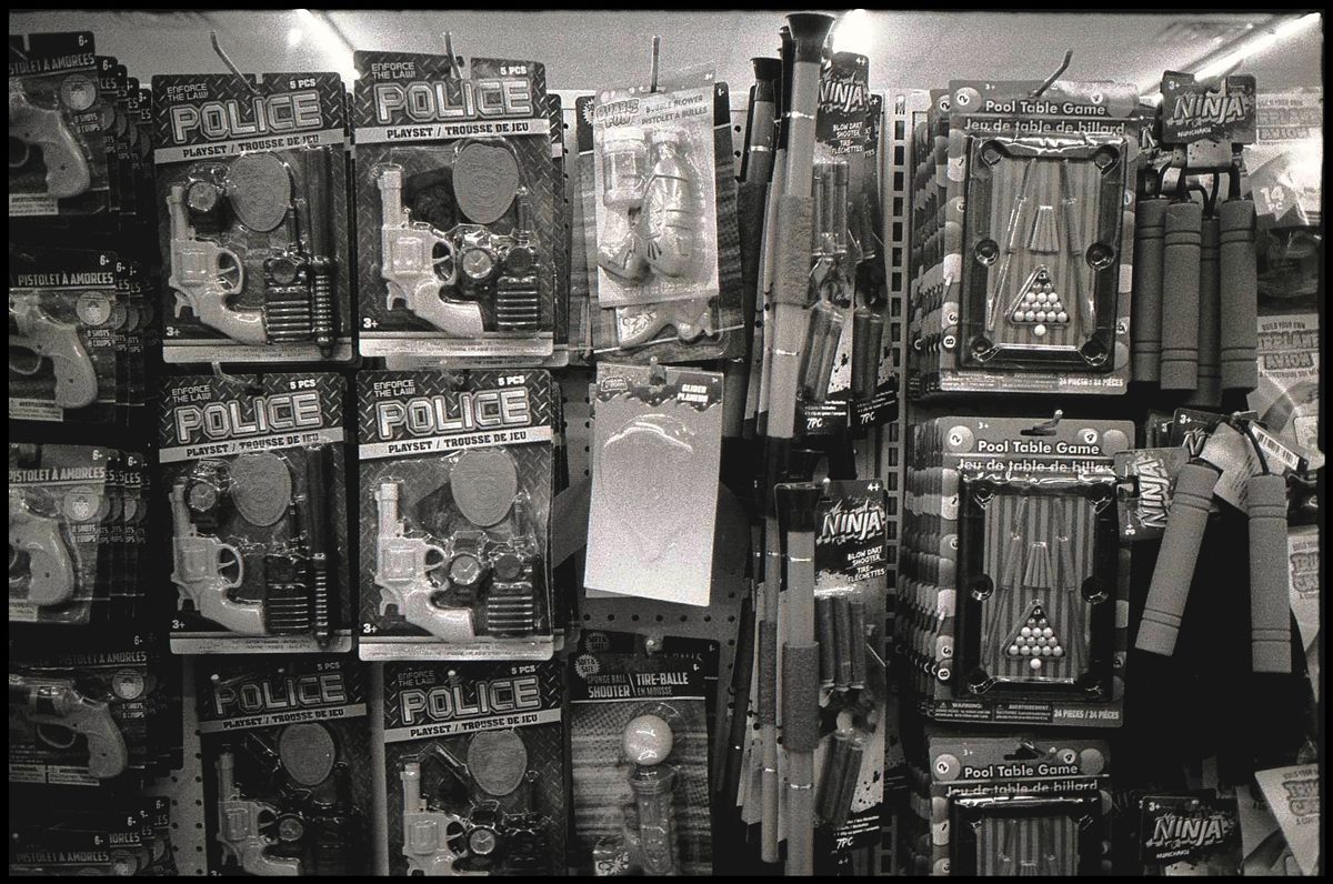 Black and white photo of a shop selling toys