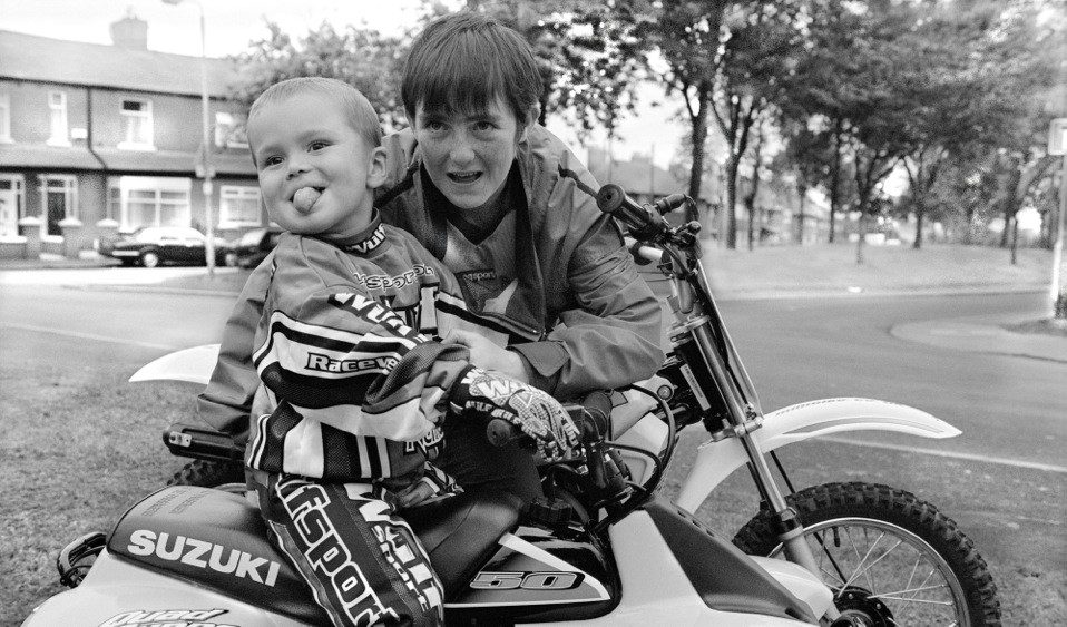 Baby and mother smiling on a bike