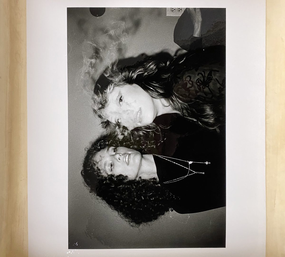 Black and white print of two girls smoking