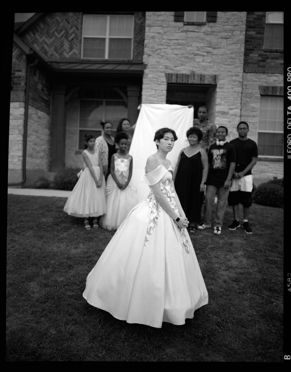 Black and white portrait of a couple dressed fr prom