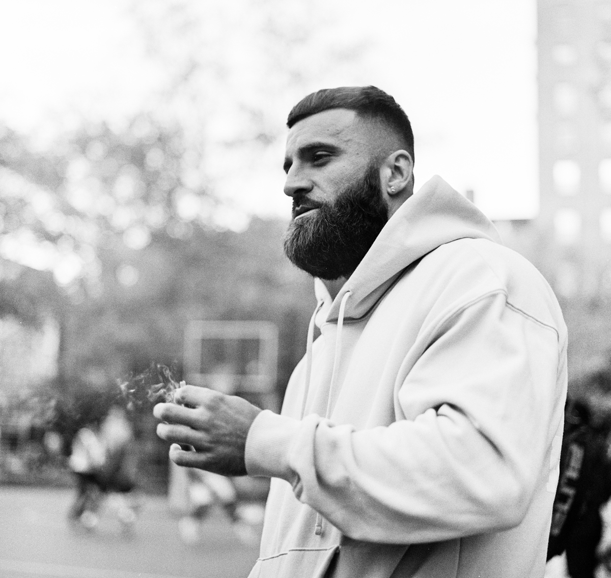 A man with a beard smoking