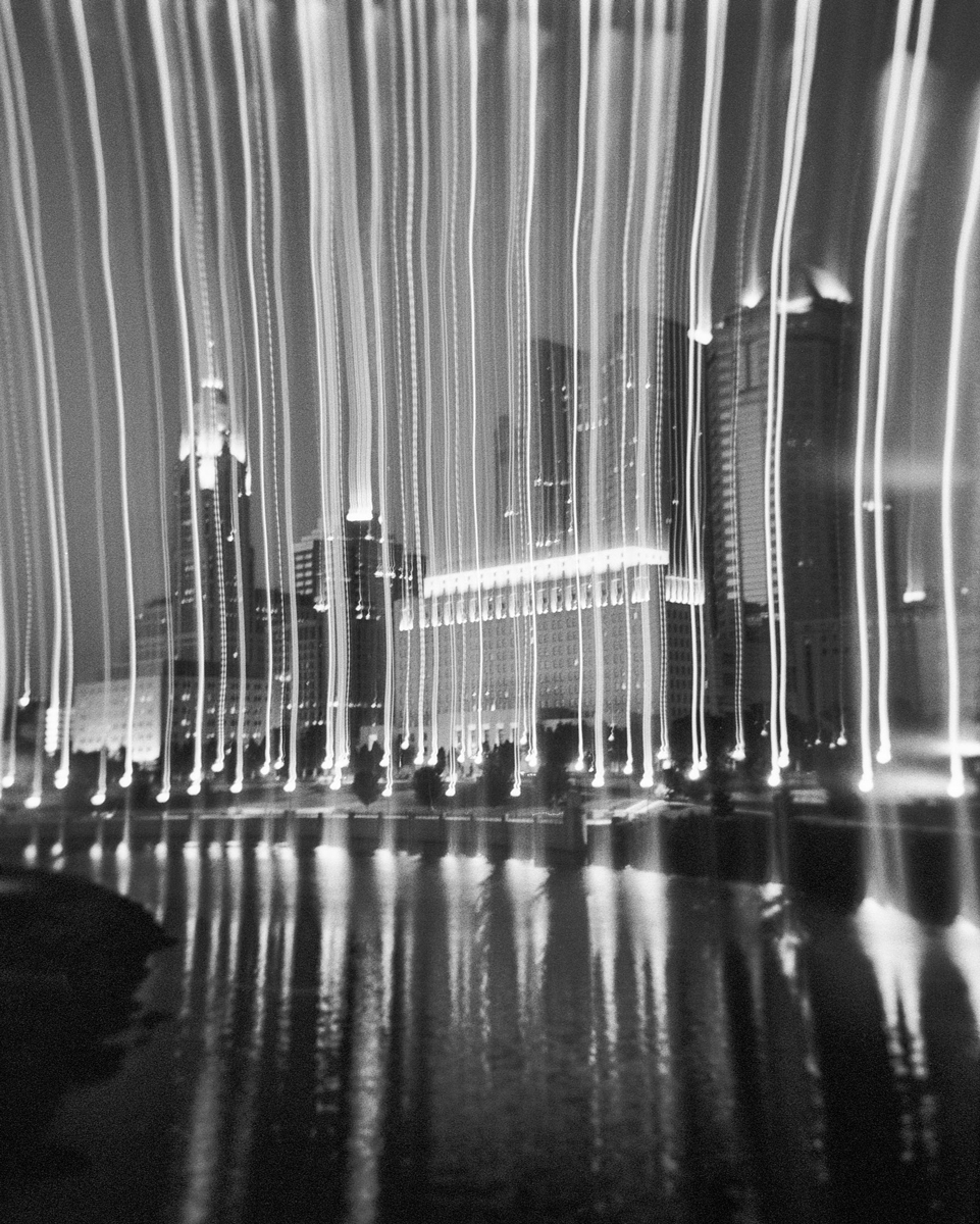 Black and white landscape of buildings with long exposure at night