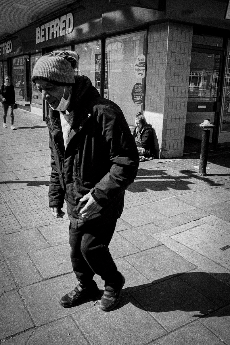 An elderly man walking