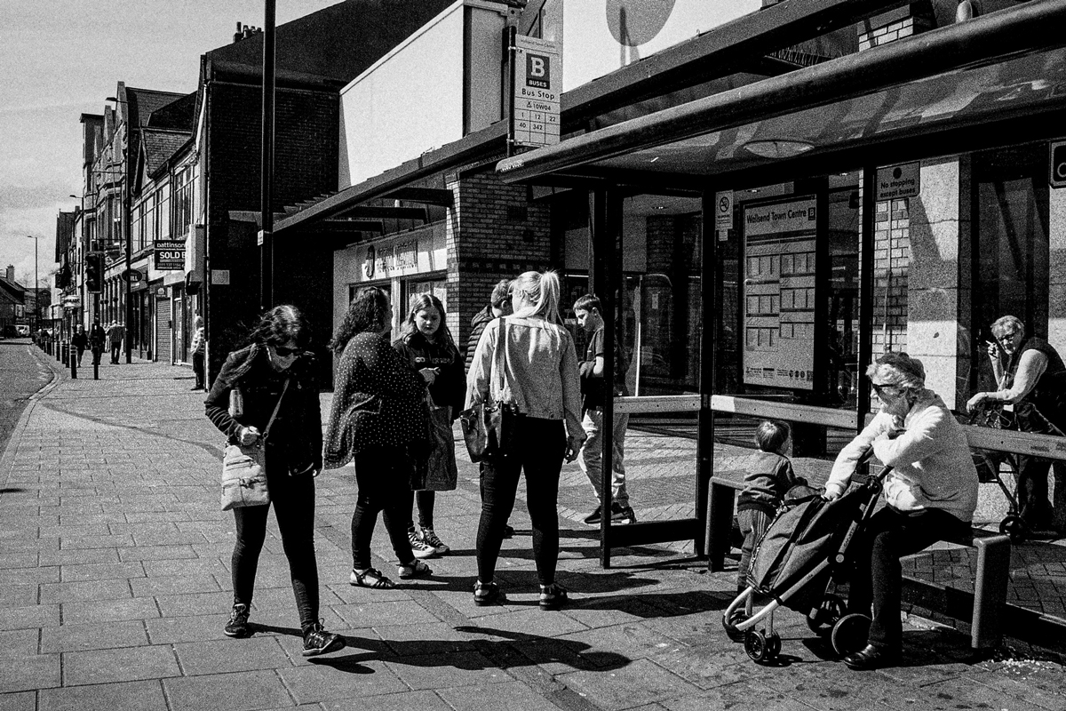 Waiting for the bus at the stop