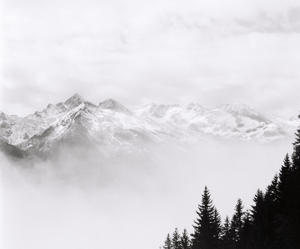 Black and white photo of snowy mountains