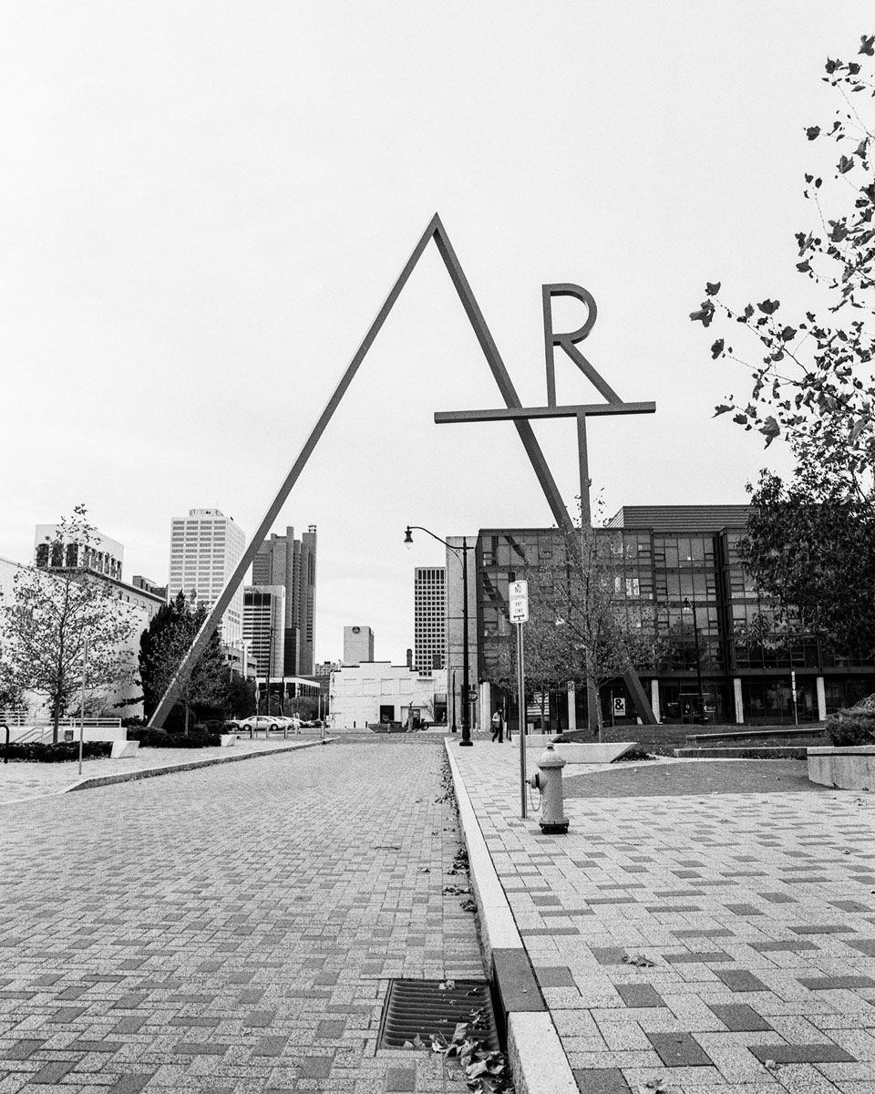 Black and white image of a street with a large triangle as the focal point #leadinglines