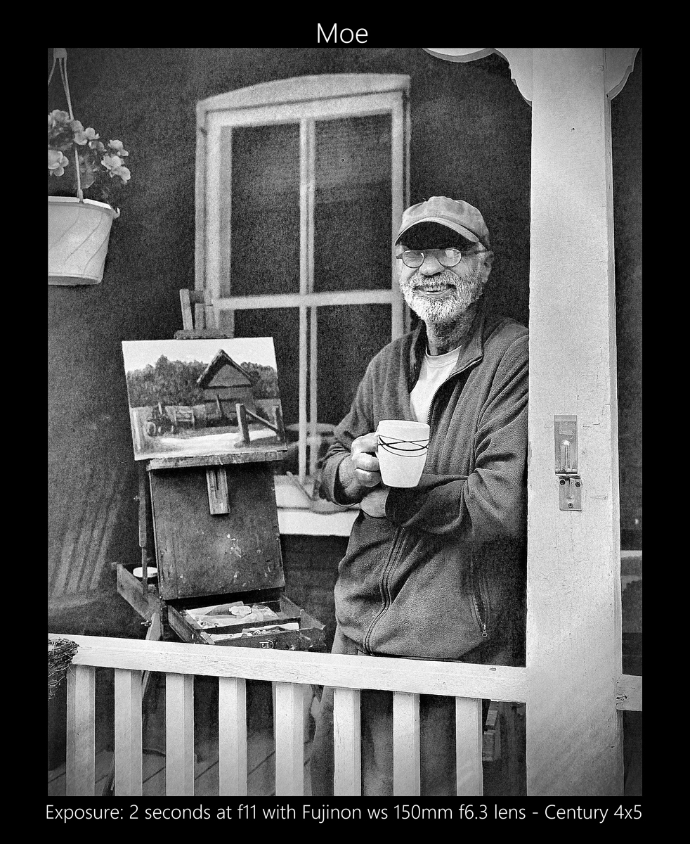 Black and white portrait of an old man on his decking