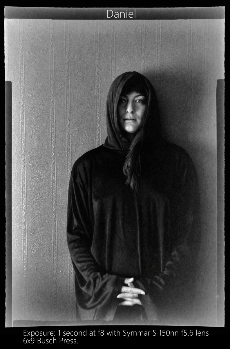Black and white portrait of a model with their hood up