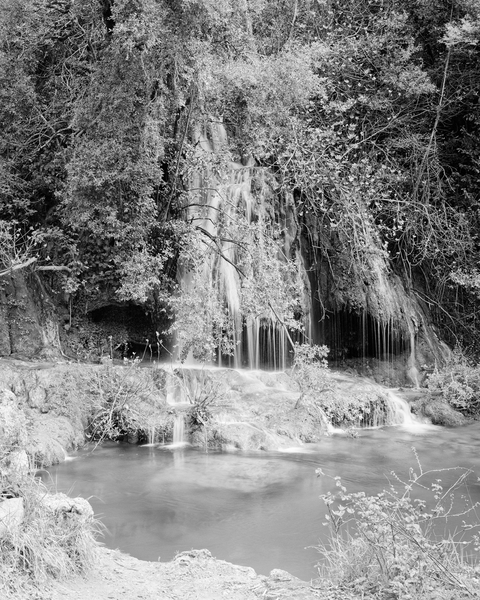 Black and white photo of a waterfall