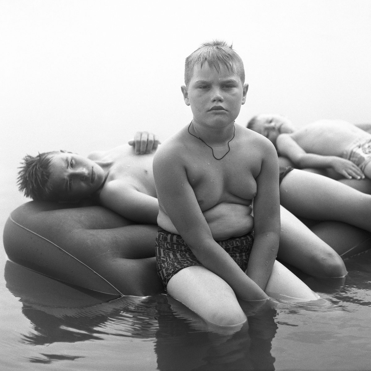 Black and white kid in water
