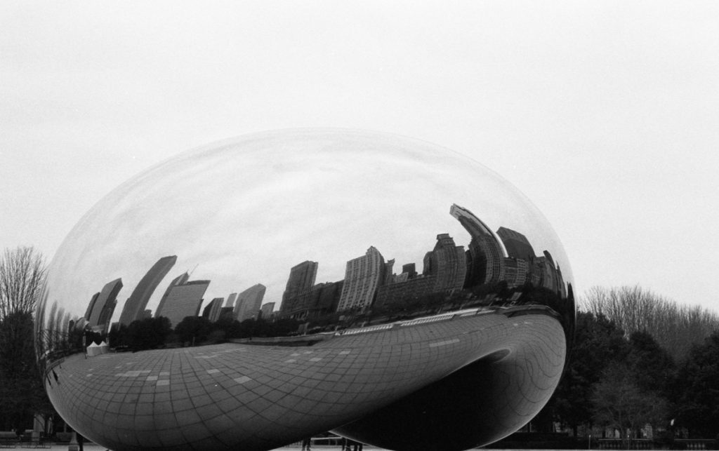 Black and white reflection in a large round mirror