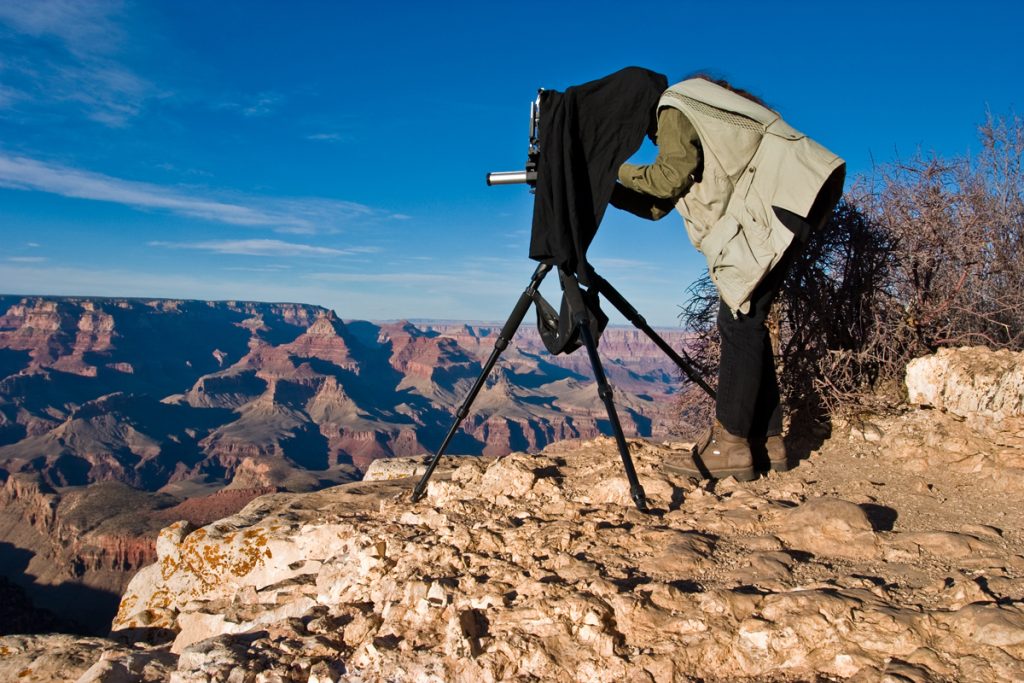 Woman shooting large format on a hike