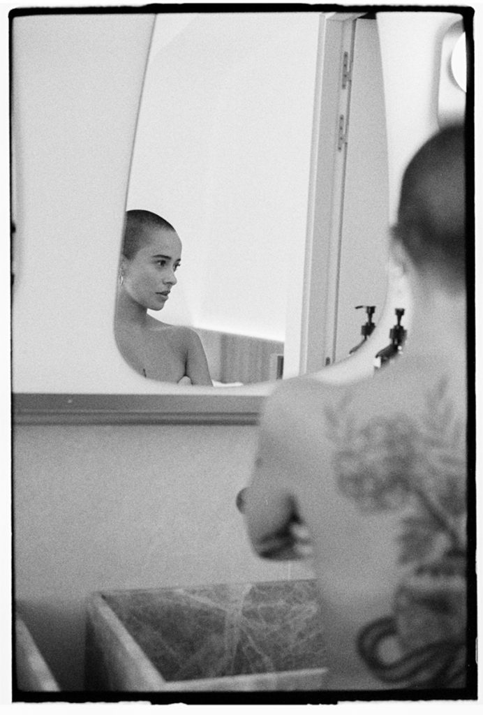 Black and white portrait through a mirror