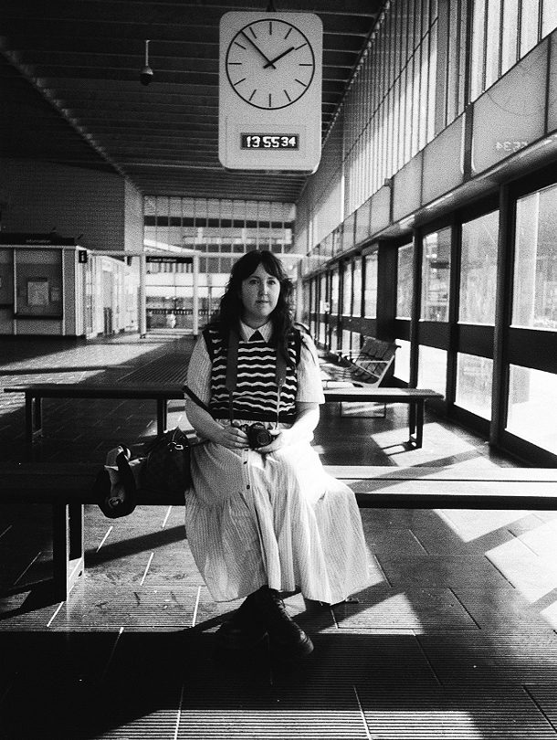 Black and white portrait of a woman sat down