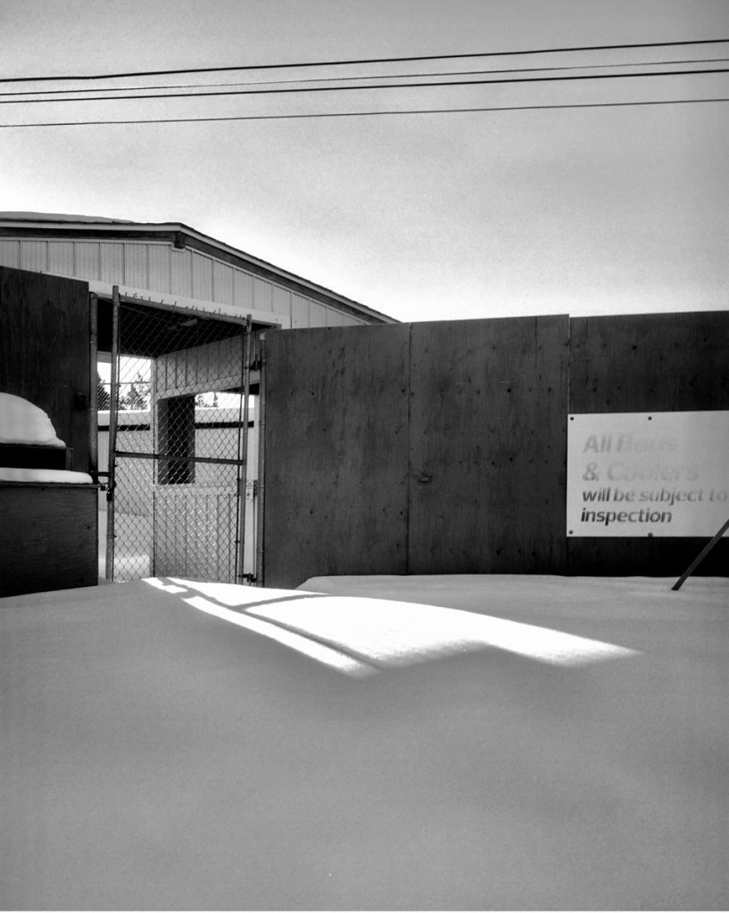 Black and white building in the snow