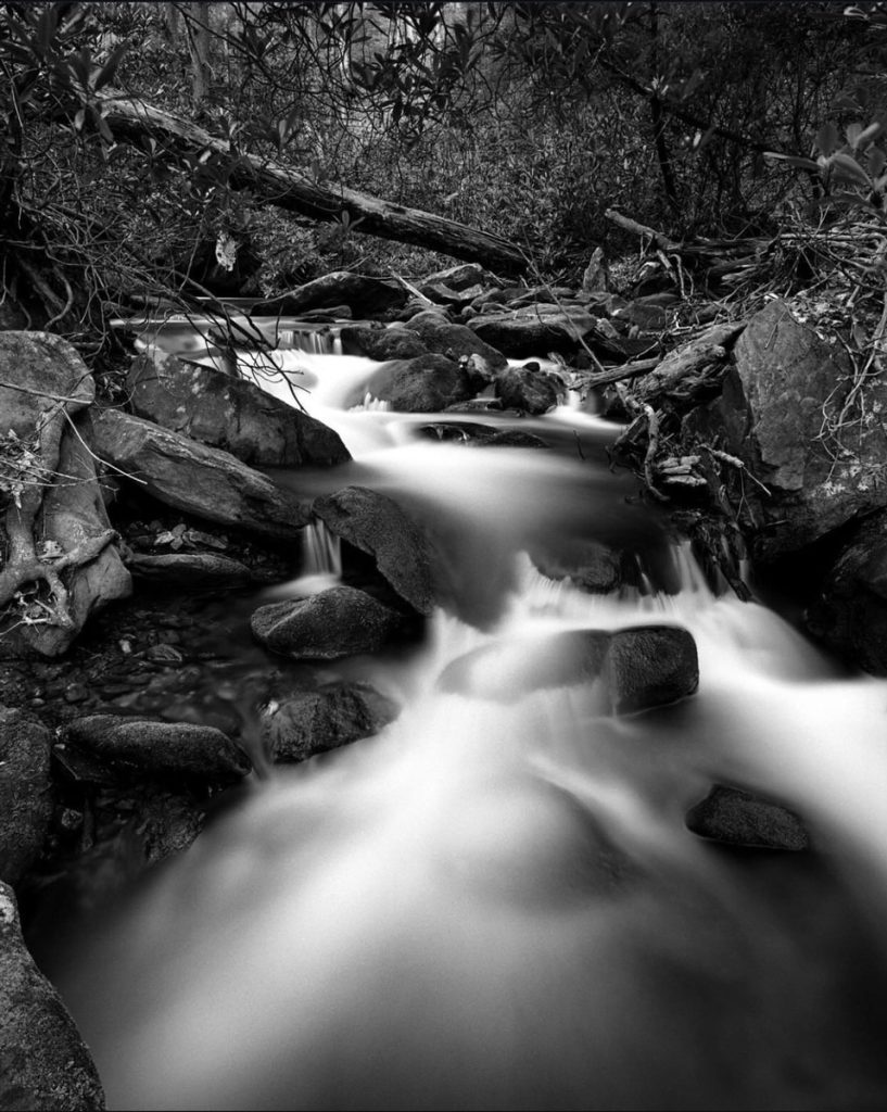 Black and white long exposure shot of a river