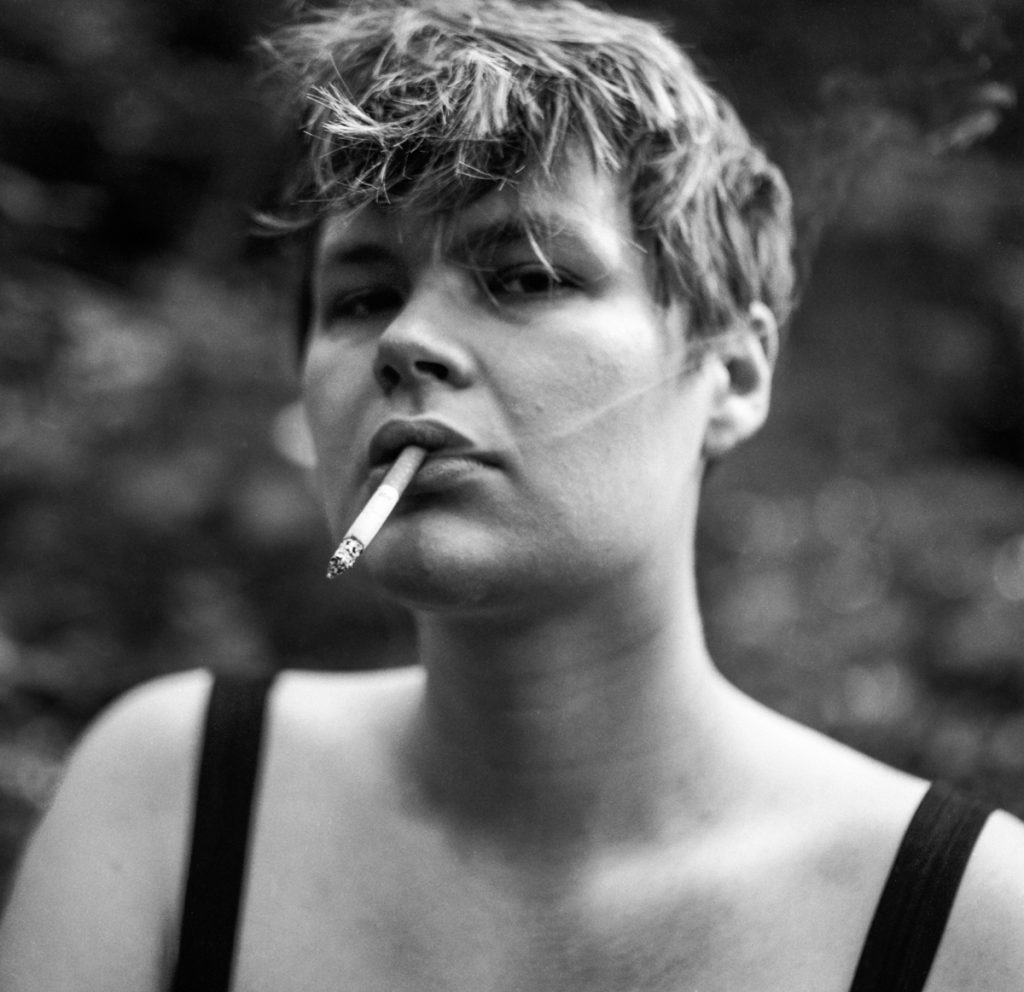 Black and white portrait of a woman smoking 