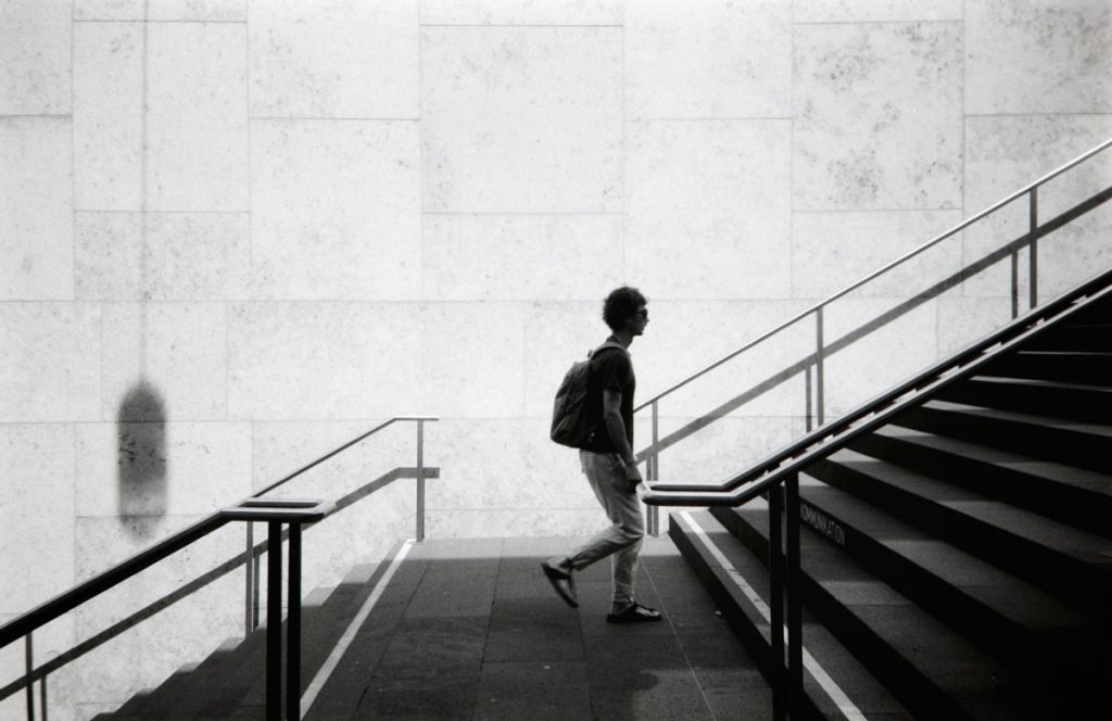 man walking up stairs